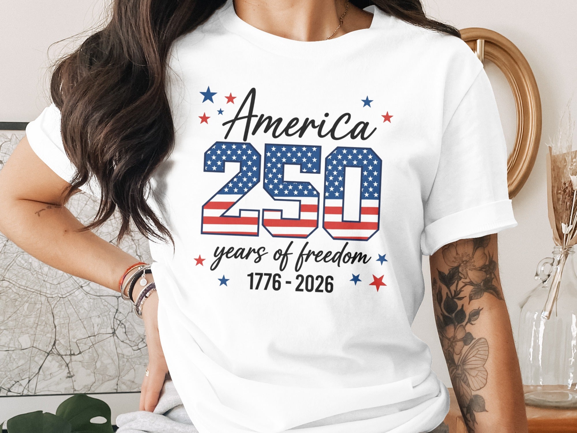 White t-shirt with "America 250 years of freedom 1776-2026" text.