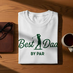 White t-shirt with "Best Dad By Par" text and golfer graphic.