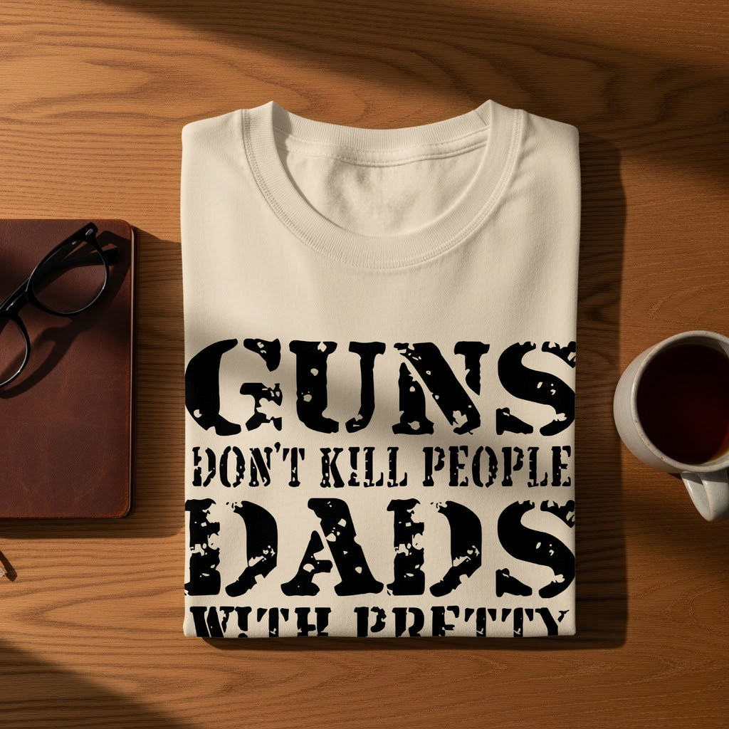 Cream t-shirt with "Guns don't kill people Dads with b*tches do" text.